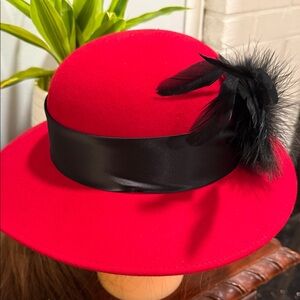 Elegant Red Women's Hat with Black Feather Accent
